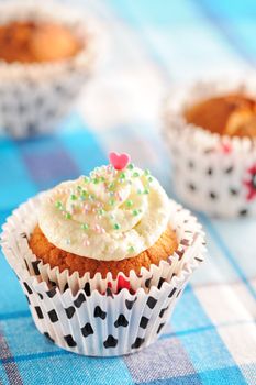 Cupcakes with whipped cream and icing