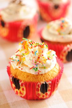 Cupcakes with whipped cream and icing