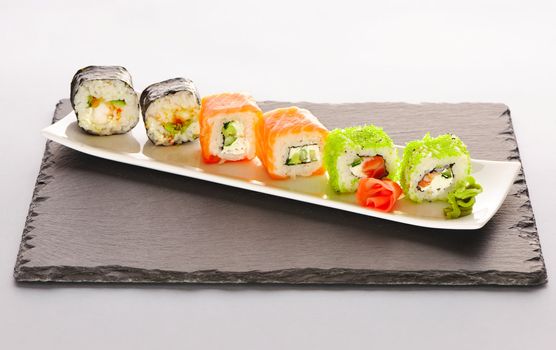 Sushi rolls on a slate plate