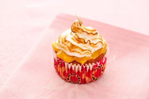 Cupcake with whipped cream and icing