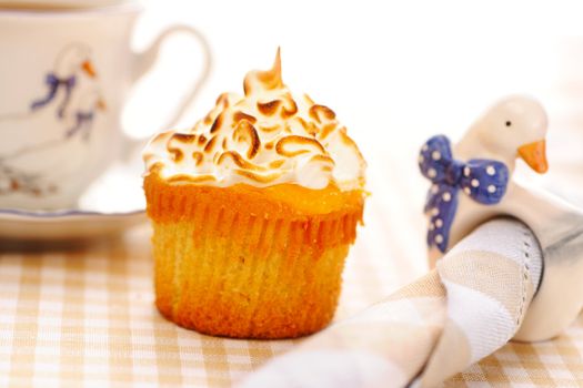Cupcake with whipped cream and icing