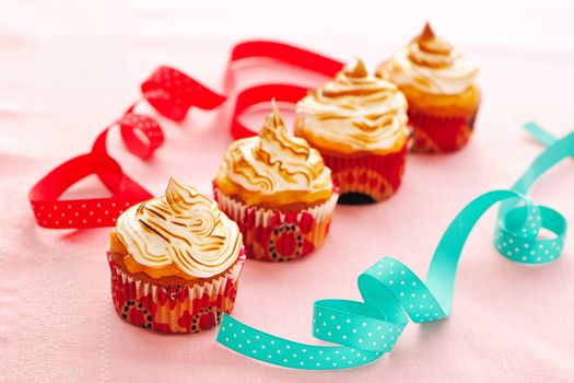 Cupcakes with whipped cream and icing