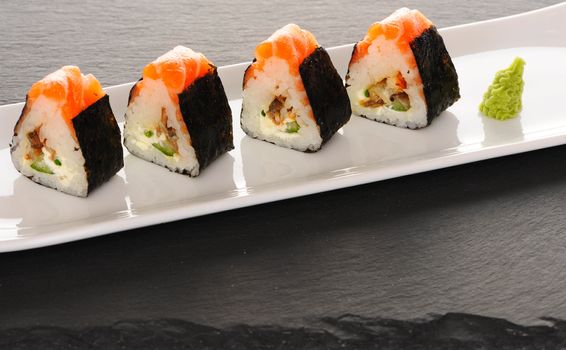 Sushi rolls on a slate plate