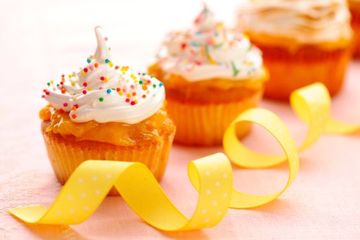 Cupcakes with whipped cream and icing