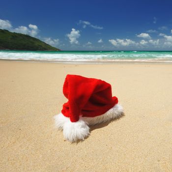 Santa's hat on a tropical beach