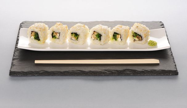 Sushi rolls on a slate plate