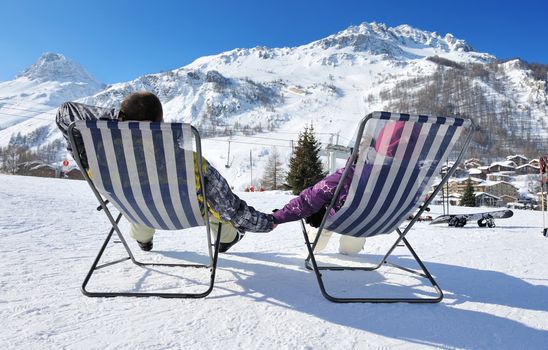 Couple at mountains in winter, Val-d'Isere, Alps, France