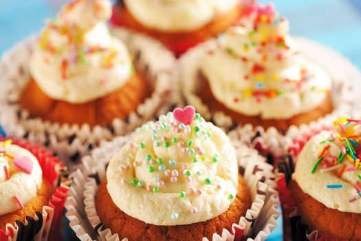 Cupcakes with whipped cream and icing