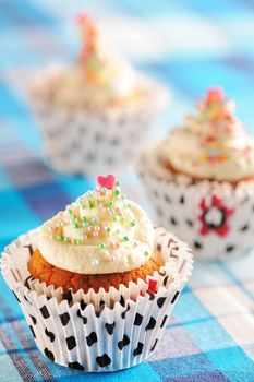 Cupcakes with whipped cream and icing