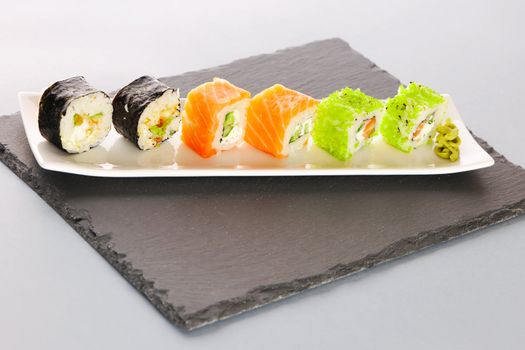Sushi rolls on a slate plate