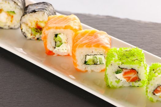 Sushi rolls on a slate plate