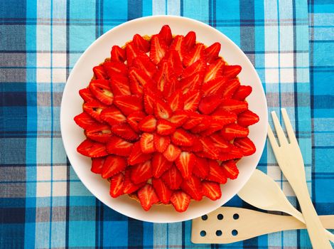 Homemade strawberry tart on table