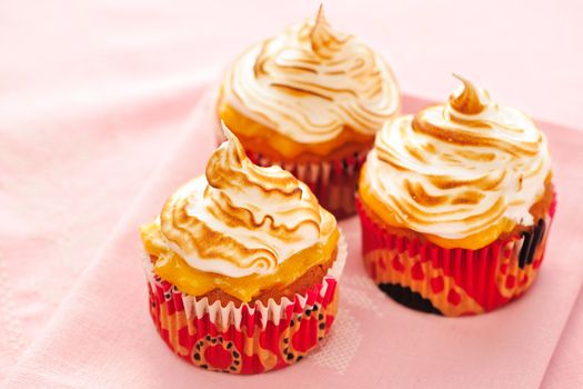 Cupcakes with whipped cream and icing