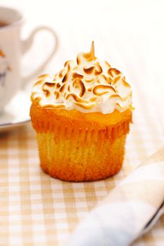 Cupcake with whipped cream and icing