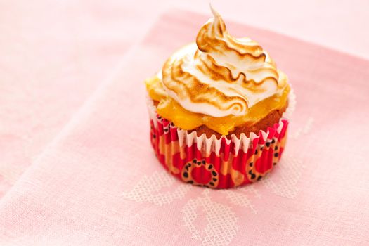 Cupcake with whipped cream and icing