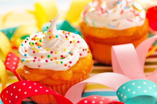Cupcakes with whipped cream and icing