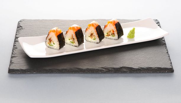 Sushi rolls on a slate plate