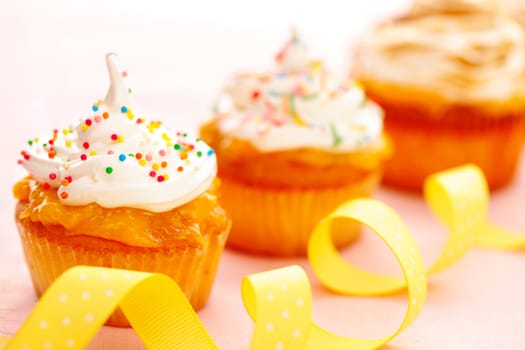 Cupcakes with whipped cream and icing