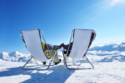 Couple at mountains in winter, Val-d'Isere, Alps, France