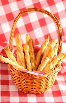 Cheese twists pastry over red cloth