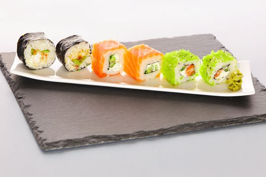 Sushi rolls on a slate plate