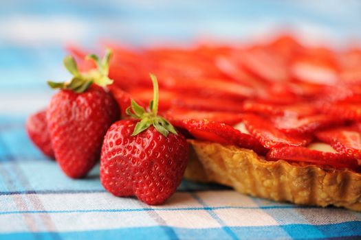 Homemade strawberry tart on table