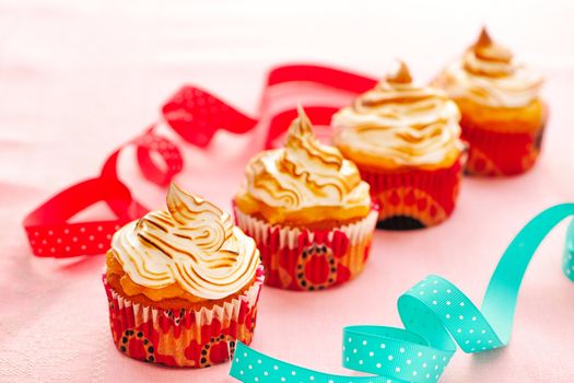 Cupcakes with whipped cream and icing