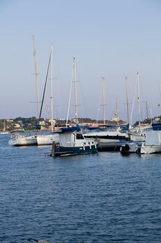 fishing boat in summer outside in sea at harbour background