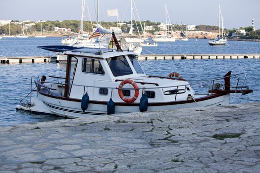 fishing boat in summer outside in sea at harbour background