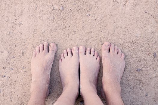 barefoot in sand and water on beach  in summer holidays relaxing