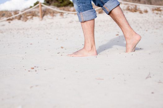 barefoot in sand and water on beach  in summer holidays relaxing