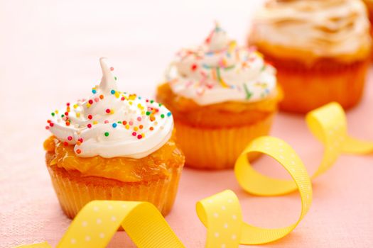 Cupcakes with whipped cream and icing