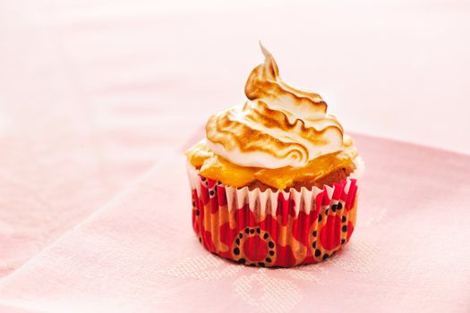 Cupcake with whipped cream and icing