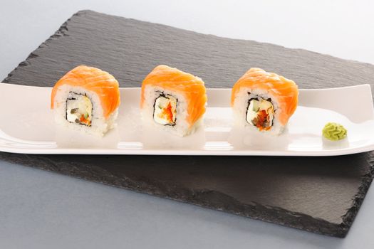 Sushi rolls on a slate plate