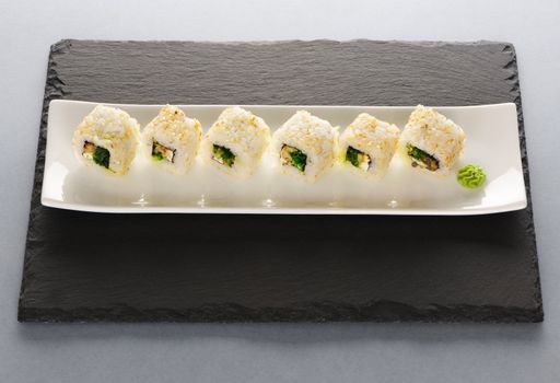 Sushi rolls on a slate plate