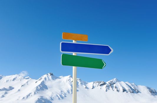 Arrow sign at mountains with snow in winter, Val-d'Isere, Alps, France