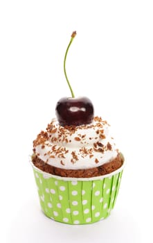 Cupcake with whipped cream and cherry isolated on white