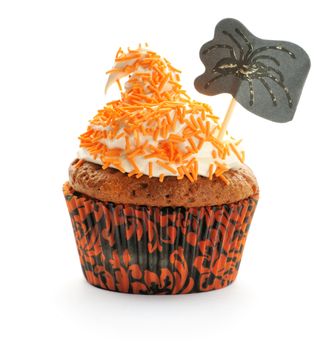 Halloween cupcake with whipped cream and decoration isolated on white