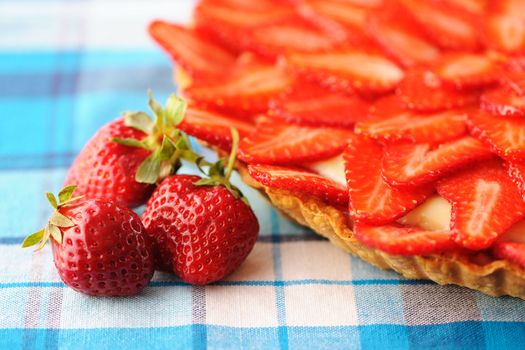 Homemade strawberry tart on table