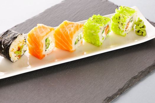 Sushi rolls on a slate plate