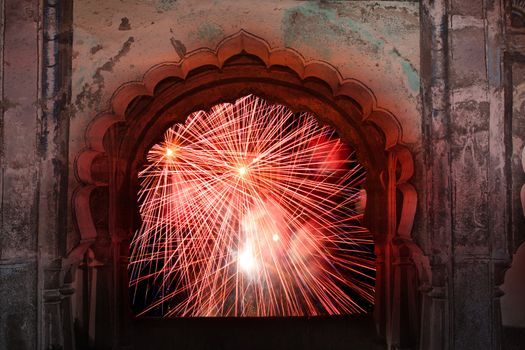 A view of traditional fireworks from the window of an ancient temple in India on the occassion of Diwali festival.