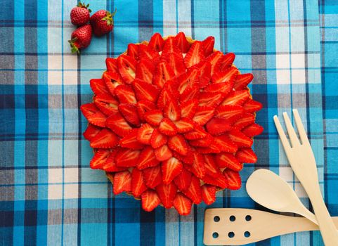 Homemade strawberry tart on table