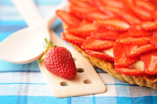 Homemade strawberry tart on table