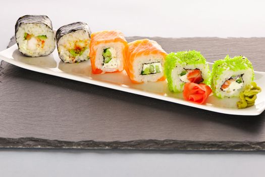 Sushi rolls on a slate plate