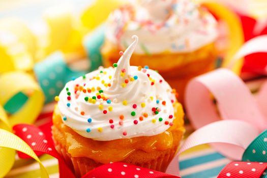Cupcakes with whipped cream and icing