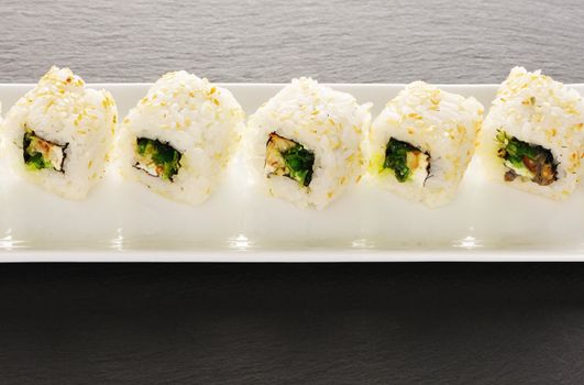 Sushi rolls on a slate plate