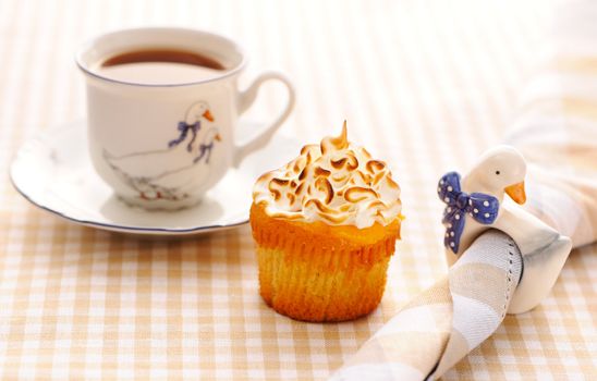 Cupcake with whipped cream and icing