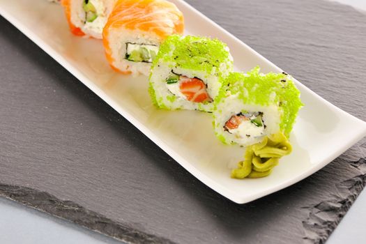 Sushi rolls on a slate plate