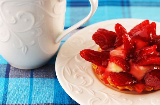 Homemade strawberry tart on table