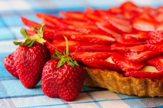 Homemade strawberry tart on table